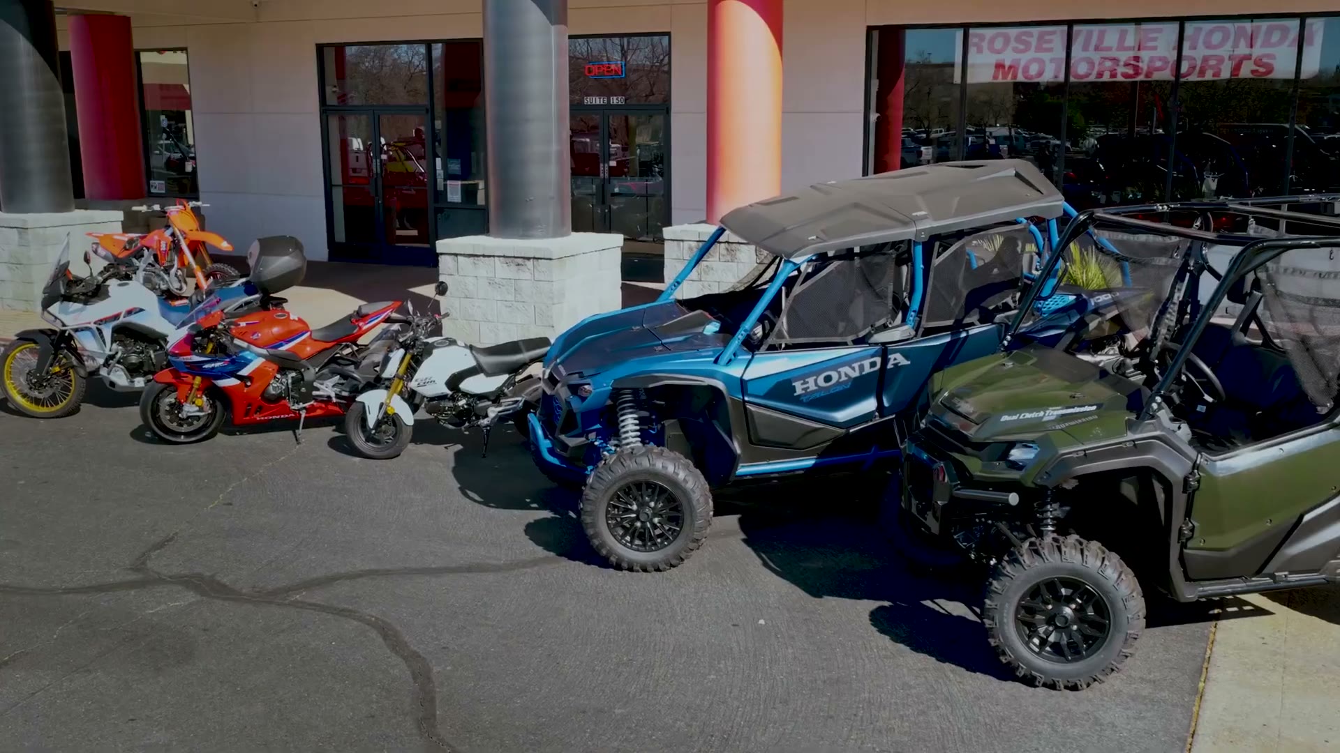 Honda motorcycles and Talon side-by-sides outside Roseville Honda Motorsports